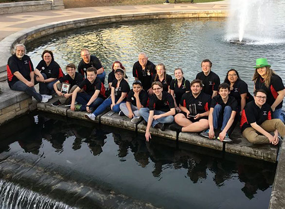 A team photo out by the fountain