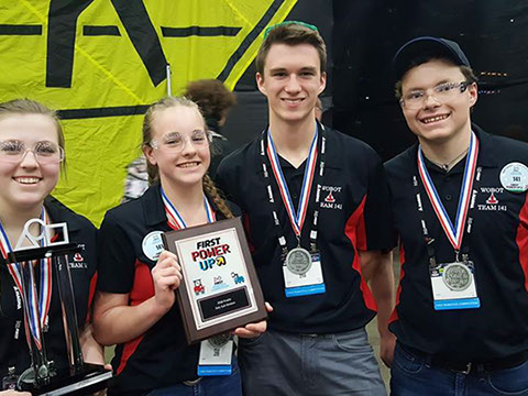 Four of our students proudly displaying their medals, trophy, and plaque for being Daly's Subdivision's 2nd place winners.