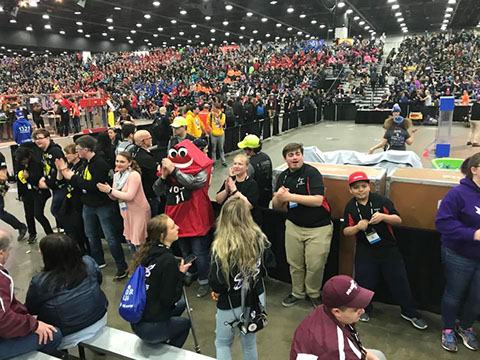 Our  mascot and some of our students having some fun dancing  between  matches.