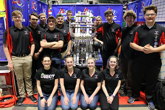 Team picture with our robot in our pit.