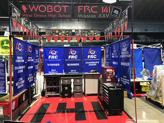 A picture of our awesome pit, which displays all of the 25 years our team has been in FIRST, with all 9 of our blue banners.