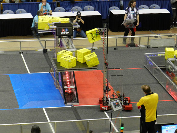 Our robot getting into position to put another cube on the scale.