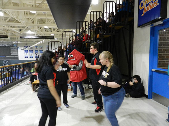 The students taking a break from scouting and dancing at a time out.