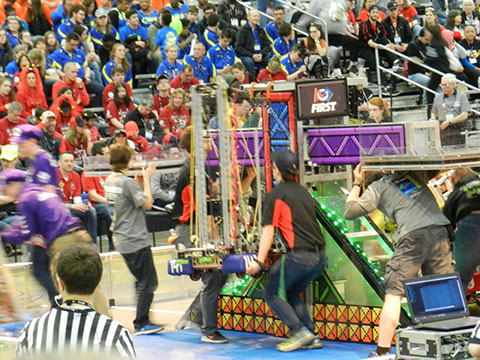 The team taking our robot down from hanging on the pole.