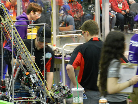 The drive team double checking the robot during a time out.