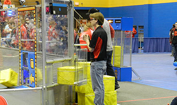 Matthew, human player, watching and waiting to insert a cube into play.