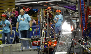 A view of our robot climbing the bar during the end game!