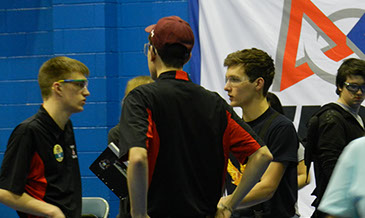 Drive team talking with one of our alliance partners before the next match.