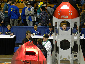 The three teams strategizing together quickly after the alliance selections.