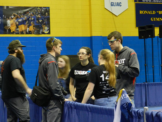 Our drive team having a quick pow - wow with a mentor