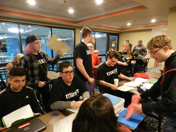 Another picture of our team going through scouting sheets, trying to come up with a list of teams for the alliance selections.