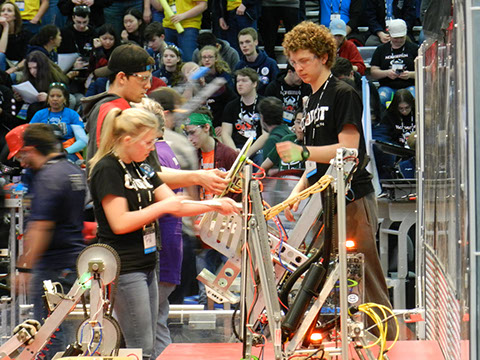 the team prepping the robot before a match