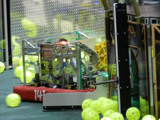 Our bot putting a gear on the peg on the airship.