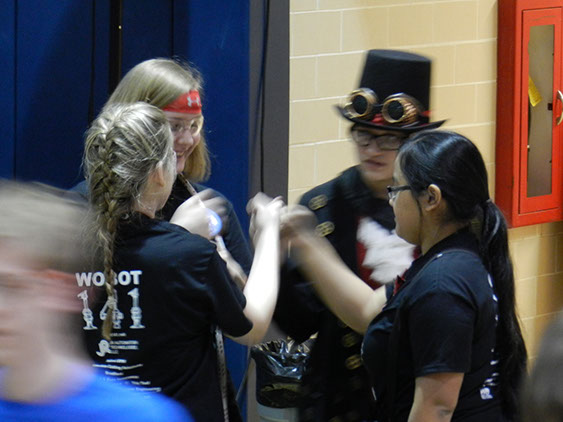 The team fist bumping before a match! Go Wobot!