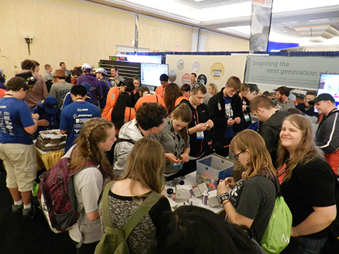 The team building brush bots at the Monsanto Booth at the Innovation Fair.