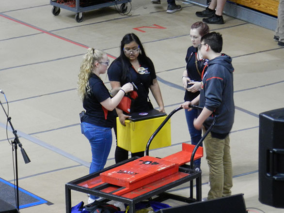 Drive team getting their gear ready for the robot removal from the field.