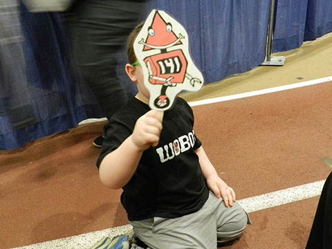 One of our team parents made and brought a bunch of  signs with our mascot on to cheer the team on with.