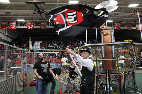 The announcer flying our flag before our match! Go Wobot!