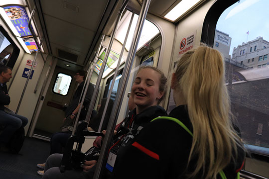 The team riding the people mover (train) to the cobo center in the morning