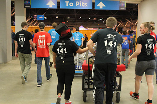 The team walking back to the pits after a practice round.